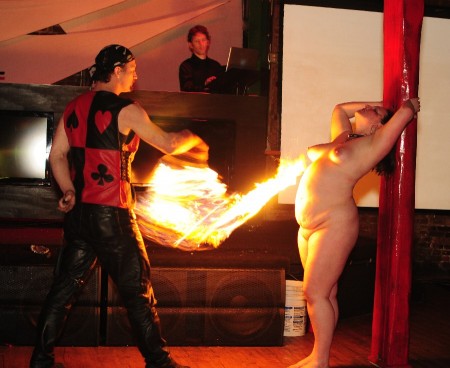 Myzeray Sensory Overload Fireplay Show - Filmed at the whiskey bar in portland oregon, myzeray and I put on a show for the crowd at the sensory overload play party. She takes torches on her skin, front and back as well as a fire flogging back and front, all for the audience's (and your) viewing pleasure.