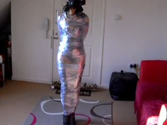 Dani Mummified And Gas Mask Hell - Dani mummified and gas mask hell. 

this is my new model dani,in this clip she is wrapped from head to toe in cling film while wearing a gas mask. She struggles and beg me to let her go but for a while let her try to get free,now and then giving her a spank with my crop and having fun covering her breathing hole. Hope you like.