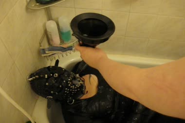 Bound Bathtub Cum Guzzling - Vanessa is bound and gagged in the tub, and guzzles a glass of cum down a funnel
