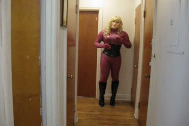Vanessa The Sex Doll - Vanessa wears her new latex female mask, catsuit, corset and boots, acting like a sex doll and asking you to buy her and use her