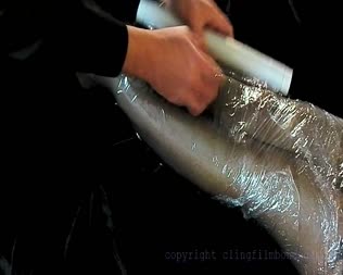 Dani Saran Wrapped  Spanked - Dani is incased in clingfilm (saran wrap) plastic and then spanked