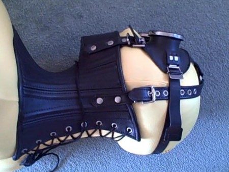 Karina In Ballet Boot Bondage - Karina is dressed in a yellow, full zentai suit, ballet boots, and shoulder-length leather gloves.  On her head she has a tightly-laced, extreme leather posture collar and a pair of blacked-out goggles.
steel handcuffs and ankle cuffs are interlinked so that karina has only limited movement.  The extreme posture collar is causing her some distress and has to be remove after about 2 1/2 minutes into the shoot.
free from the collar she may be, but transparent plastic wrapping gradually covers her arms from wrists to elbows, followed progressively by her hands, feet and then abdomen.
by the end of the shoot karina is once again inescapably bound.